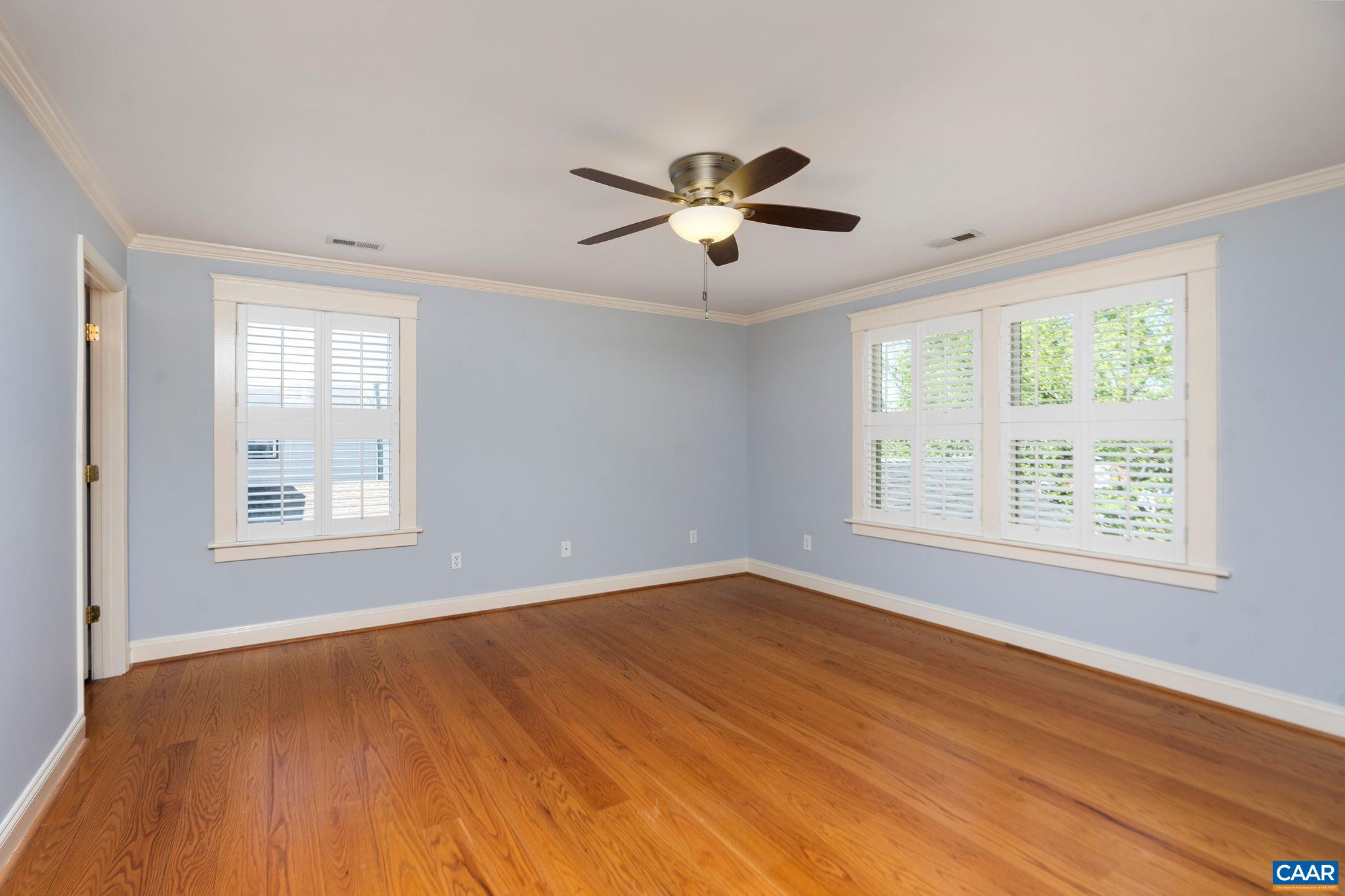 417 9th Street Northwest Charlottesville, VA 22903 - Photo 17 of 33 a view of an empty room with wooden floor and a window
