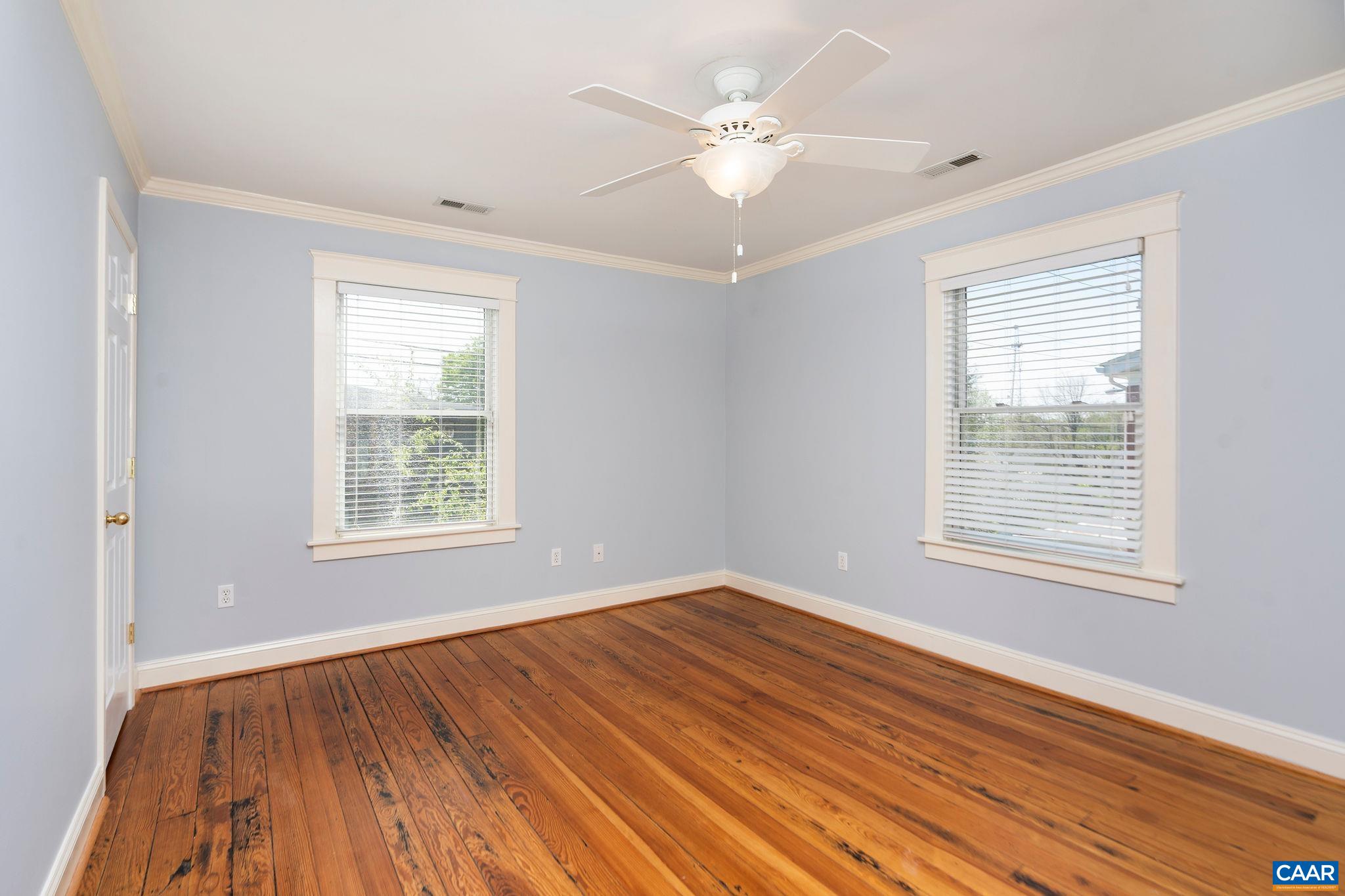 417 9th Street Northwest Charlottesville, VA 22903 - Photo 24 of 33 a view of an empty room with wooden floor and a window