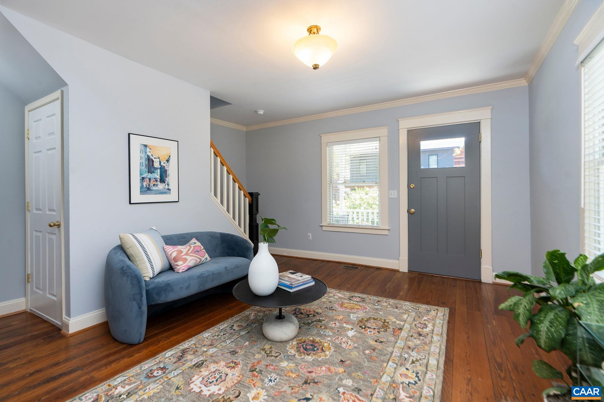 417 9th Street Northwest Charlottesville, VA 22903 - Photo 4 of 33 a living room with furniture and wooden floor