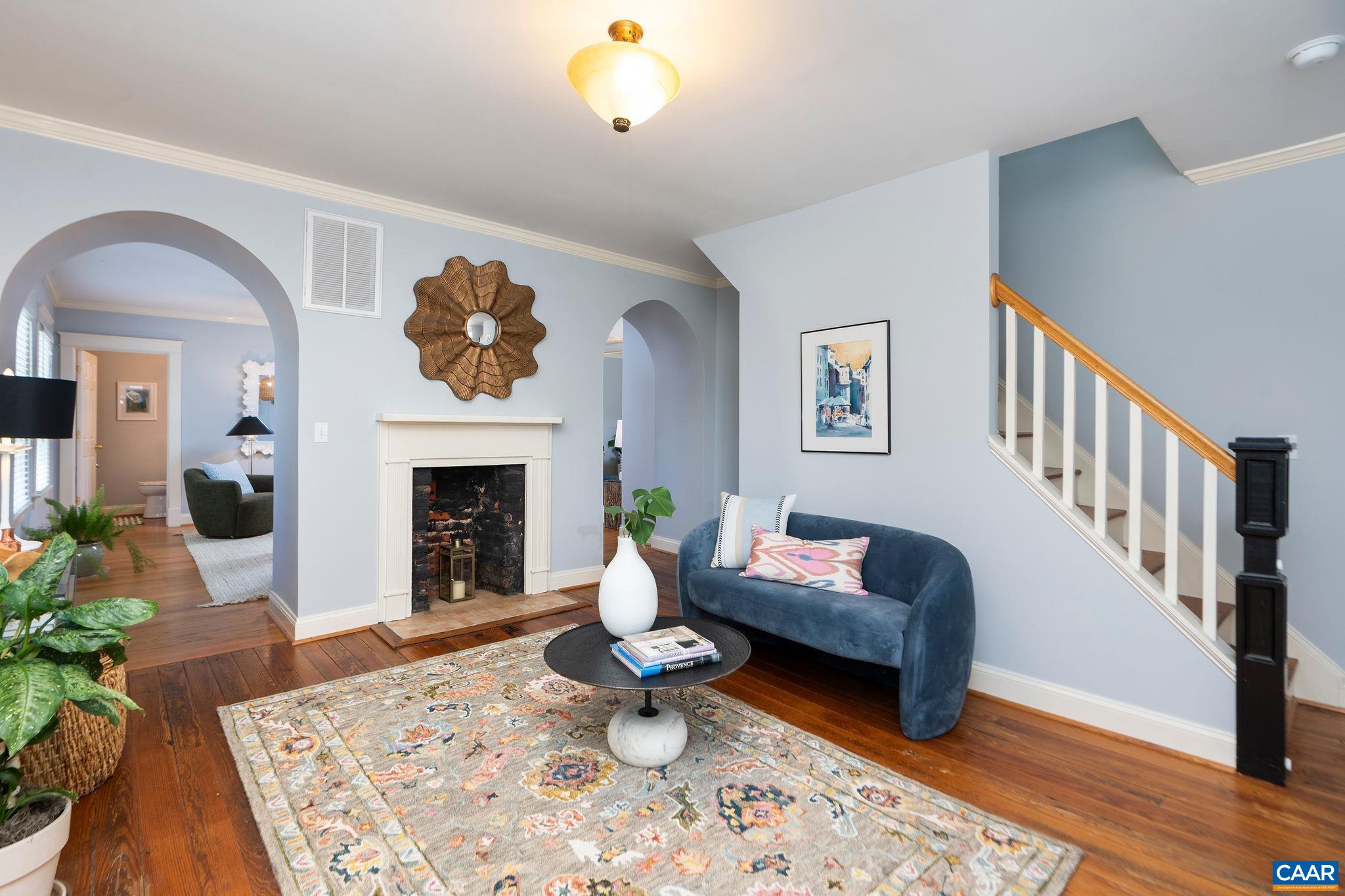 417 9th Street Northwest Charlottesville, VA 22903 - Photo 5 of 33 a living room with furniture and a fireplace