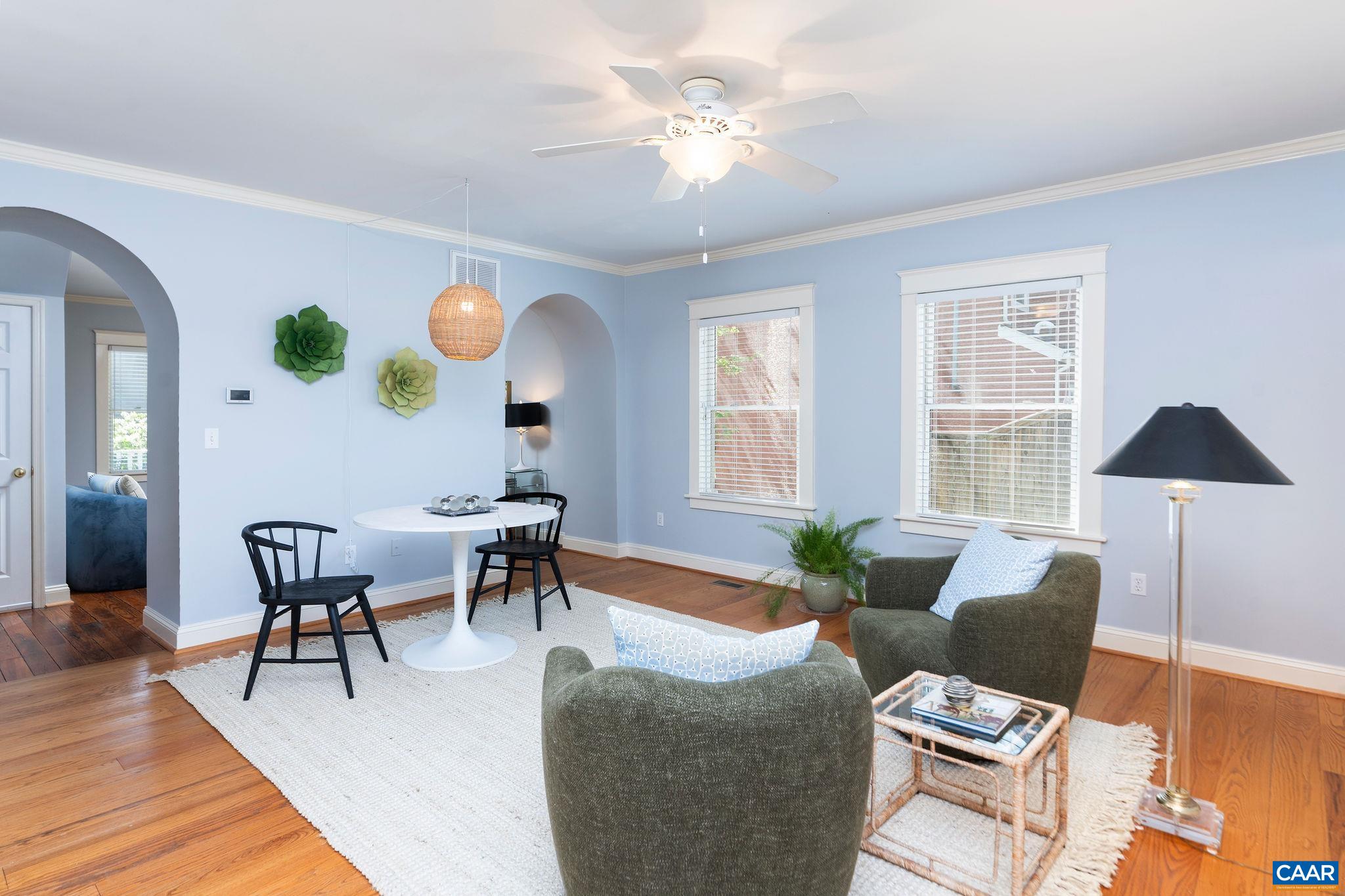 417 9th Street Northwest Charlottesville, VA 22903 - Photo 7 of 33 a living room with furniture and a lamp