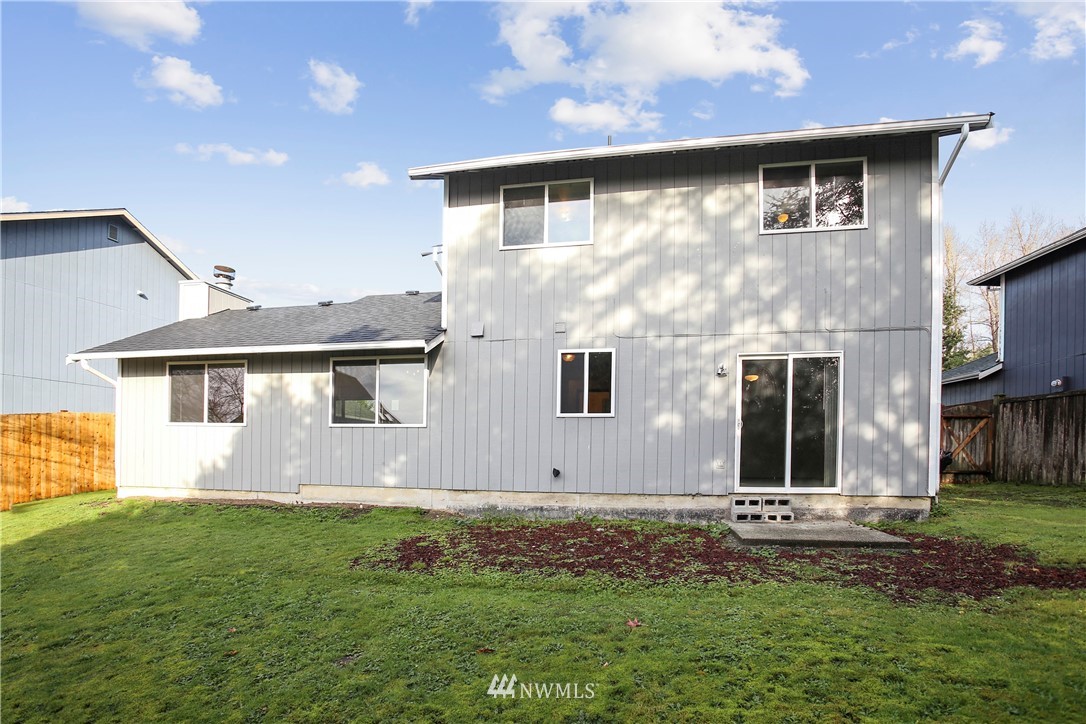 1216 223rd Street Southwest Bothell, WA 98021 - Photo 22 of 22 a front view of a house with a yard