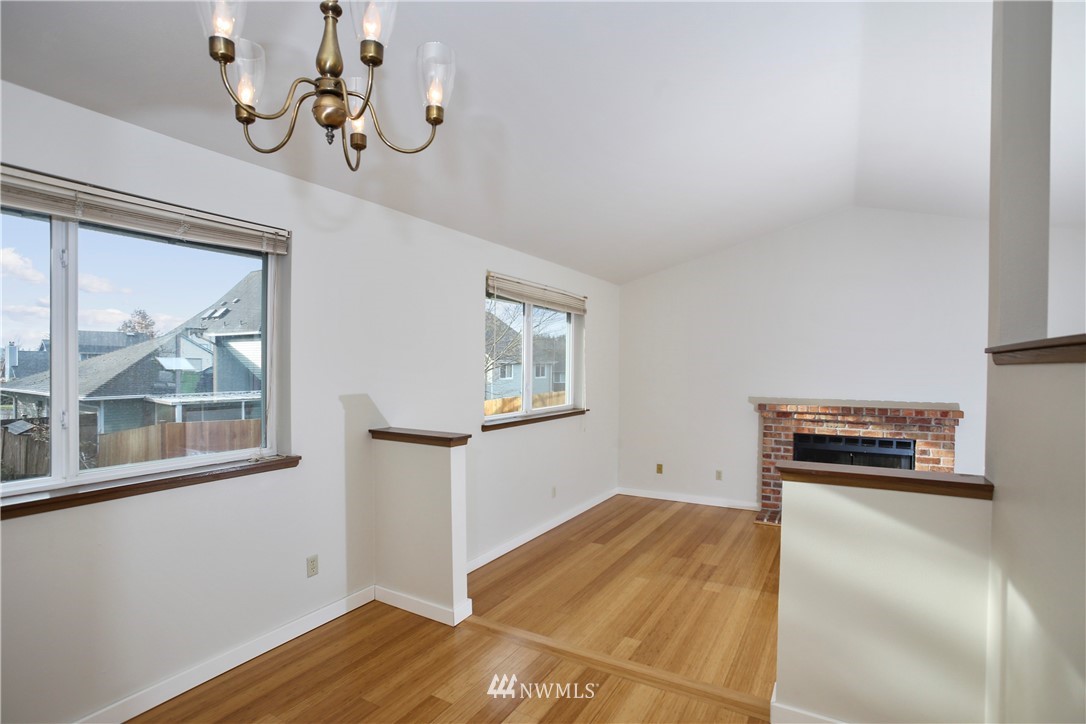 1216 223rd Street Southwest Bothell, WA 98021 - Photo 6 of 22 a bedroom with a bed and wooden floor