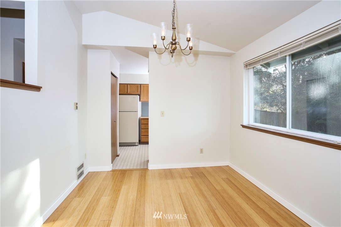 1216 223rd Street Southwest Bothell, WA 98021 - Photo 7 of 22 a view of empty room with wooden floor and fan