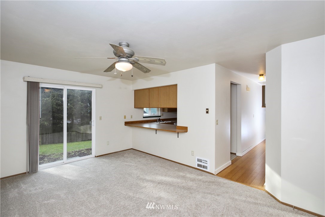 1216 223rd Street Southwest Bothell, WA 98021 - Photo 9 of 22 a view of a kitchen with a sink and a refrigerator