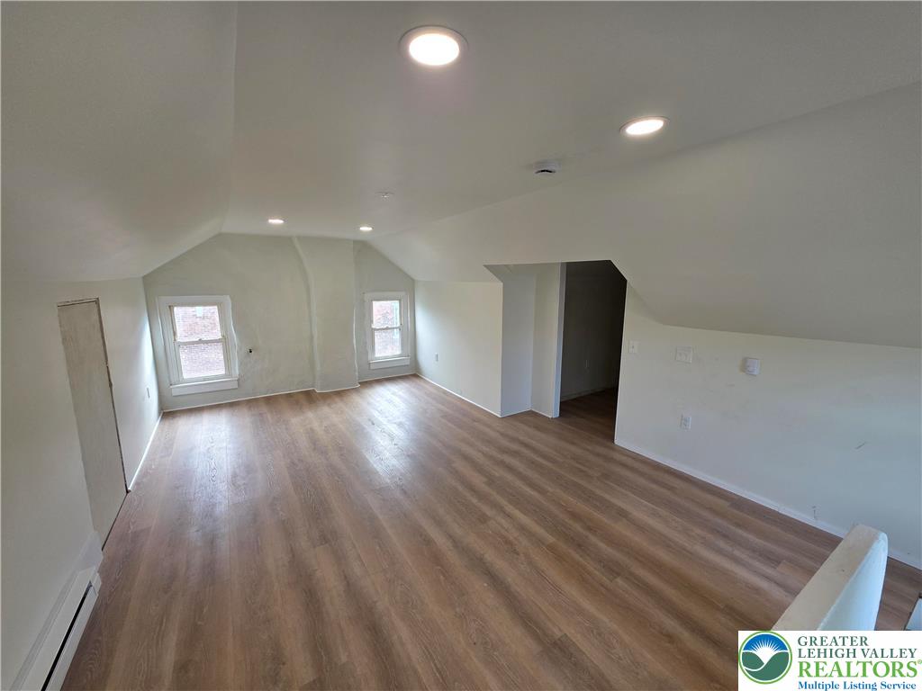 122 East Goepp Street, Unit 3 Bethlehem, PA 18018 - Photo 11 of 12 a view of an empty room with wooden floor and a window