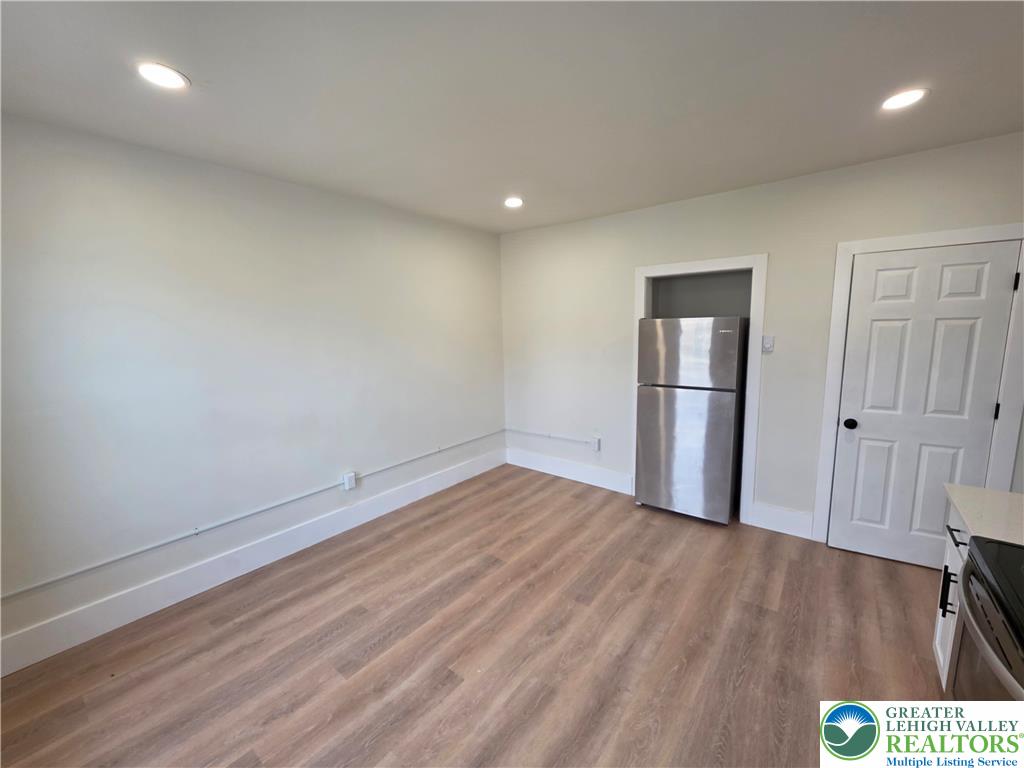 122 East Goepp Street, Unit 3 Bethlehem, PA 18018 - Photo 3 of 12 a view of empty room with wooden floor and fan