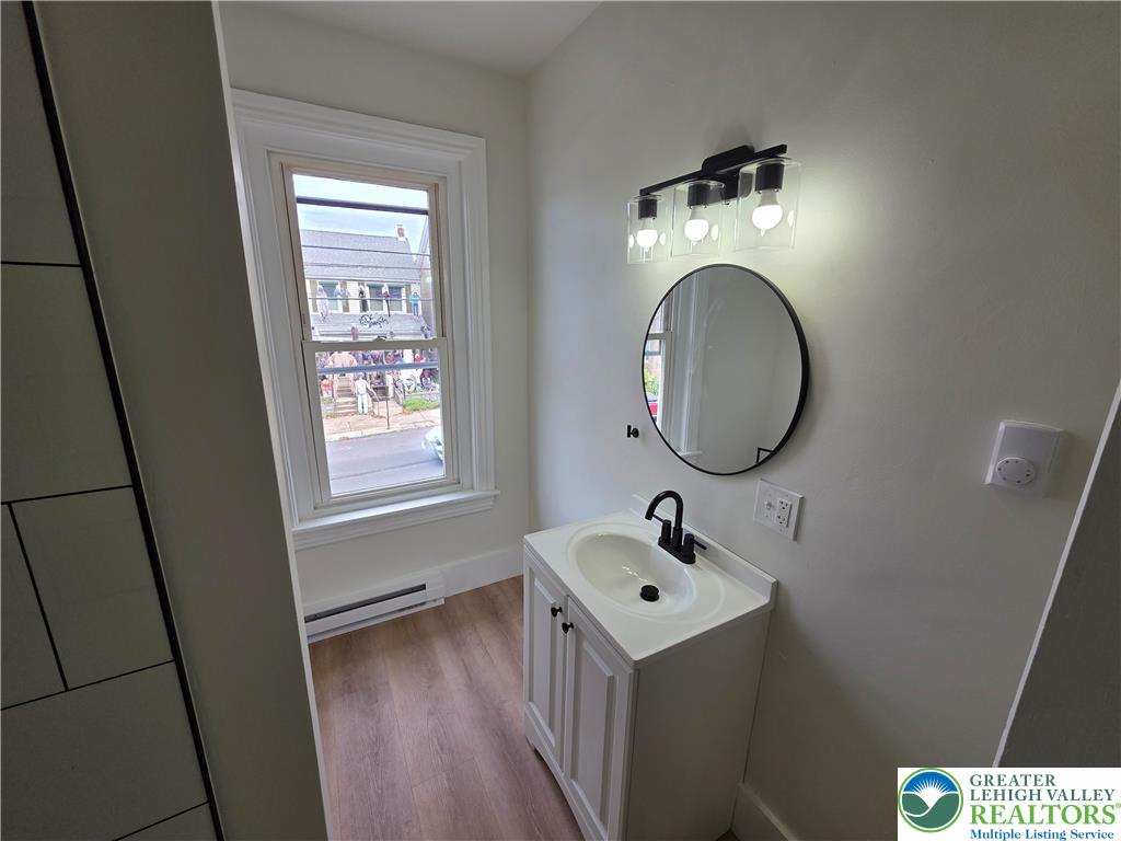 122 East Goepp Street, Unit 3 Bethlehem, PA 18018 - Photo 9 of 12 a bathroom with a sink and a mirror
