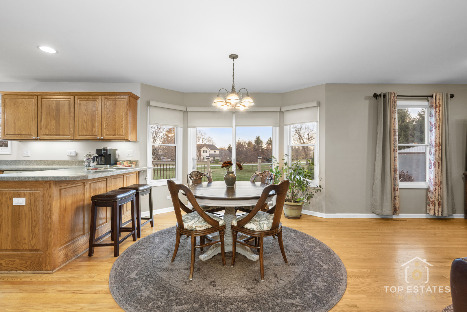 2303 Fox Bluff Lane Spring Grove, IL 60081 - Photo 16 of 38 a dining room with furniture window and wooden floor