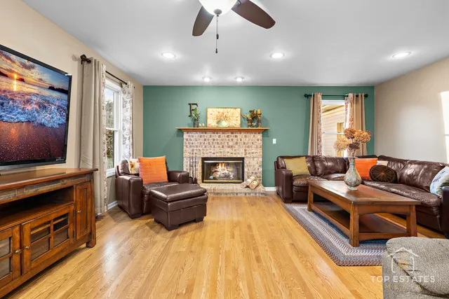 a living room with furniture and a fireplace