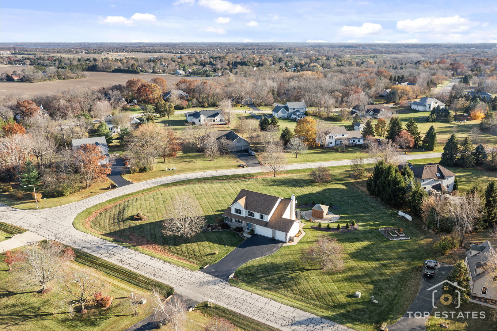 2303 Fox Bluff Lane Spring Grove, IL 60081 - Photo 2 of 38 a view of a swimming pool and lake view