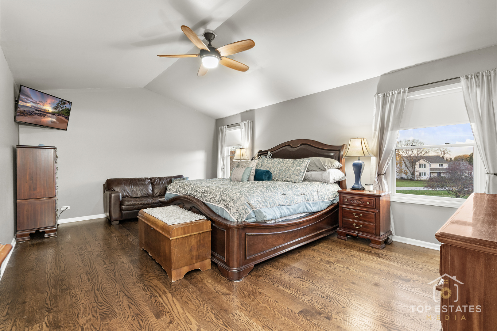 2303 Fox Bluff Lane Spring Grove, IL 60081 - Photo 23 of 38 a bedroom with a bed and a chandelier