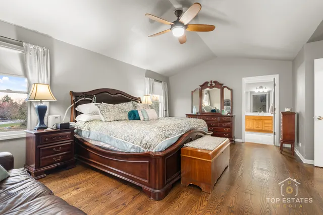 a bedroom with a bed dresser and a window