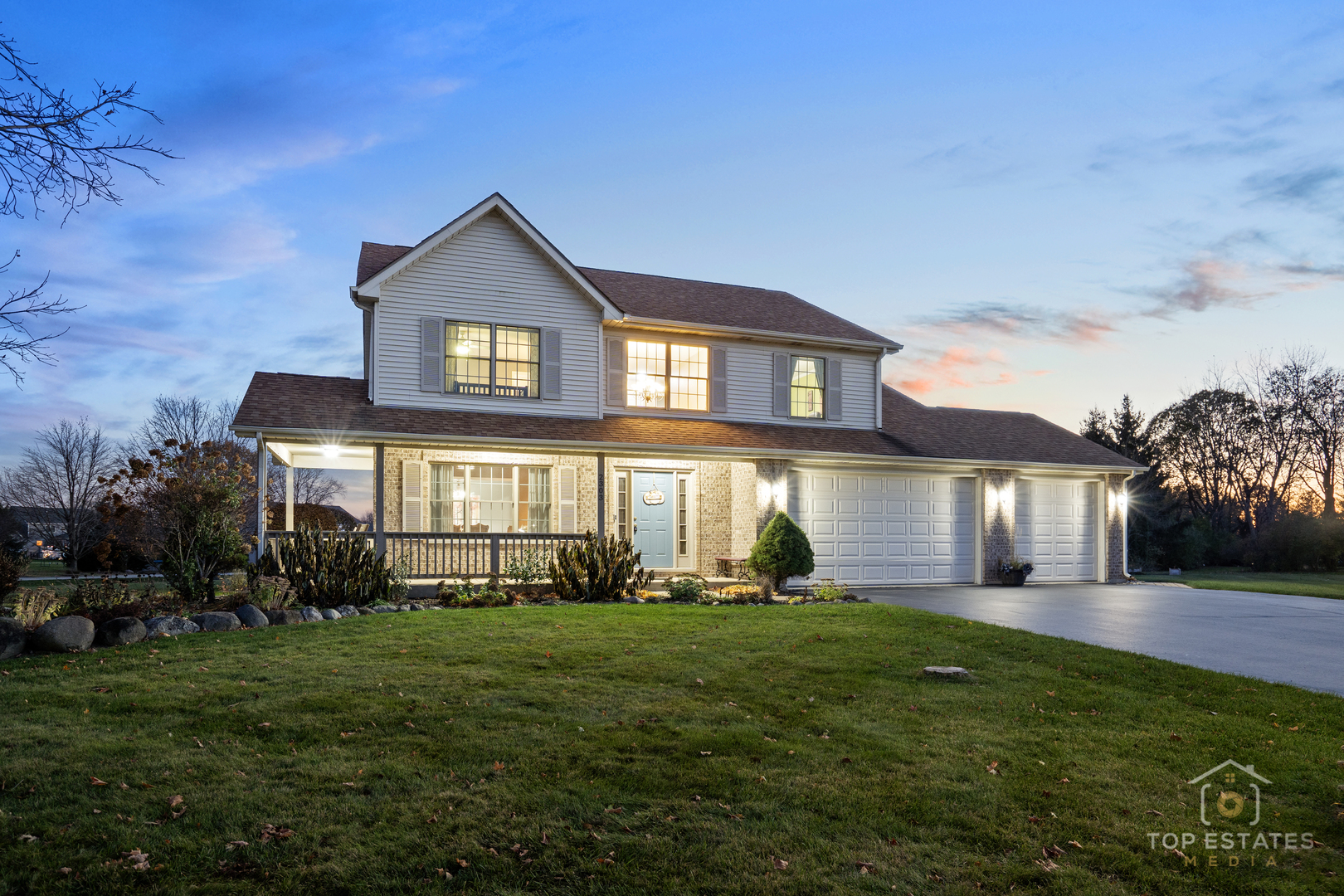 2303 Fox Bluff Lane Spring Grove, IL 60081 - Photo 35 of 38 a large tree in front of a house with a yard