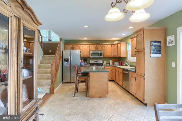 a kitchen with counter top space cabinets and stainless steel appliances