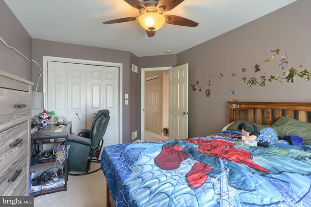 a bedroom with a bed and furniture