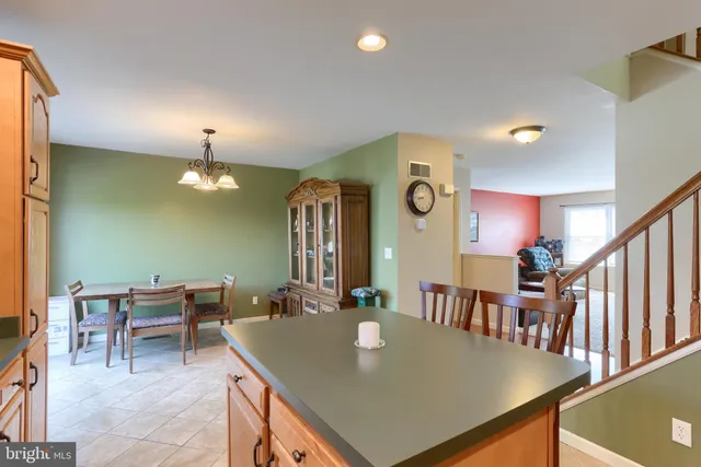 a view of a dining room with furniture and a chandelier
