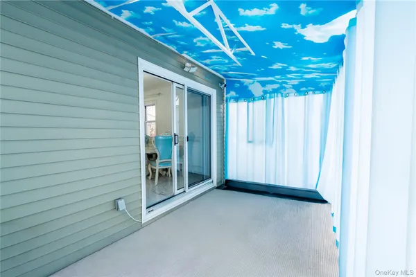 a view of a room with wooden walls