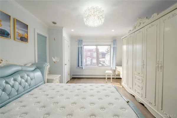 a spacious bedroom with a large bed and a window