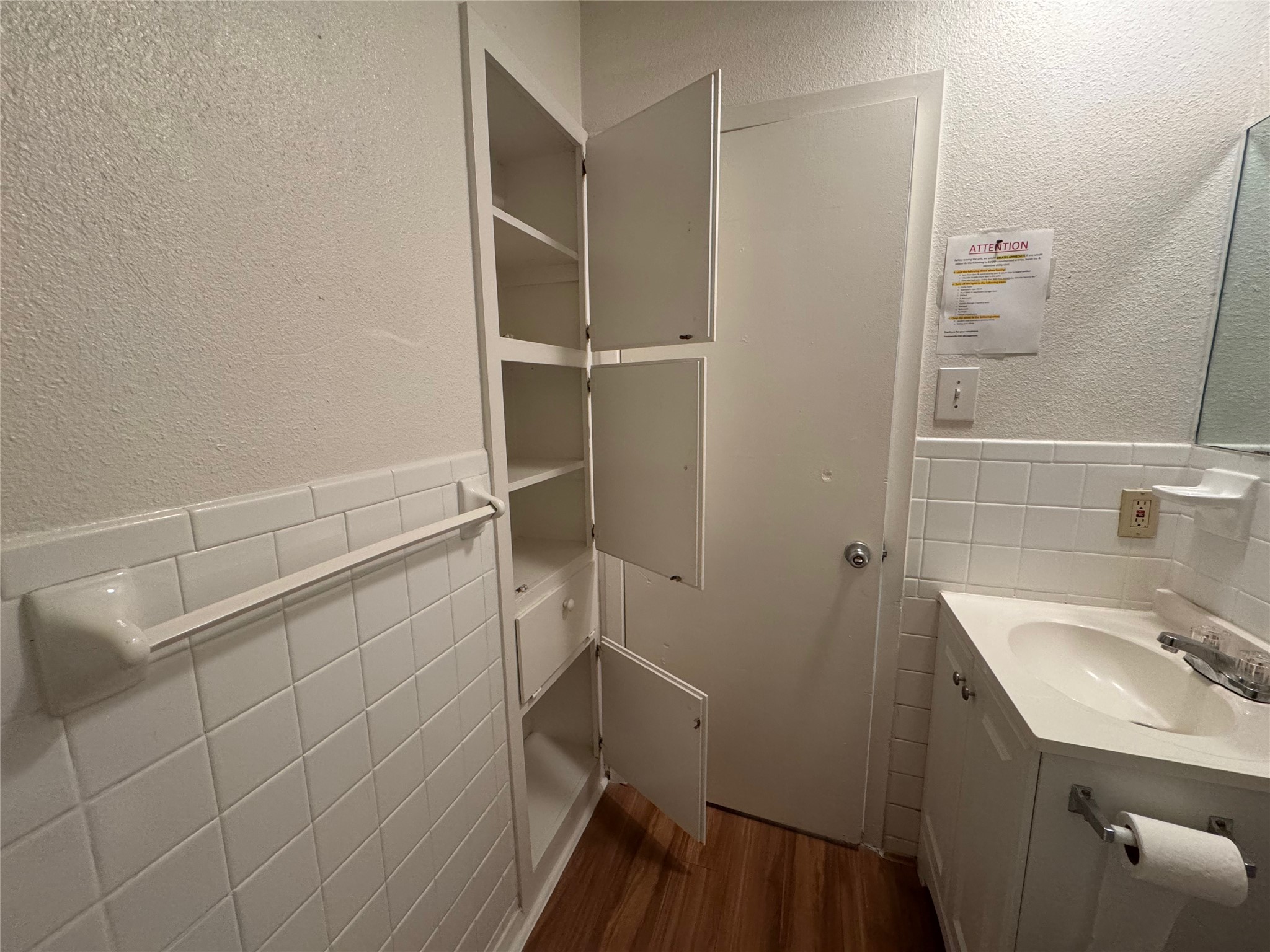4810 West Wind Trail, Unit 104 Austin, TX 78745 - Photo 11 of 21 a bathroom with a sink and mirror