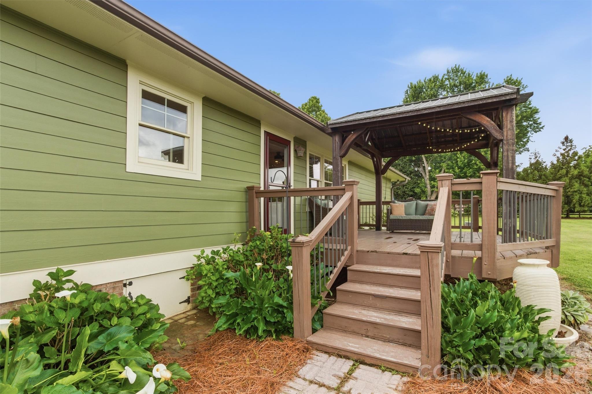 4712 Secrest Short Cut Road Monroe, NC 28110 - Photo 21 of 30 a view of a house with backyard and stairs