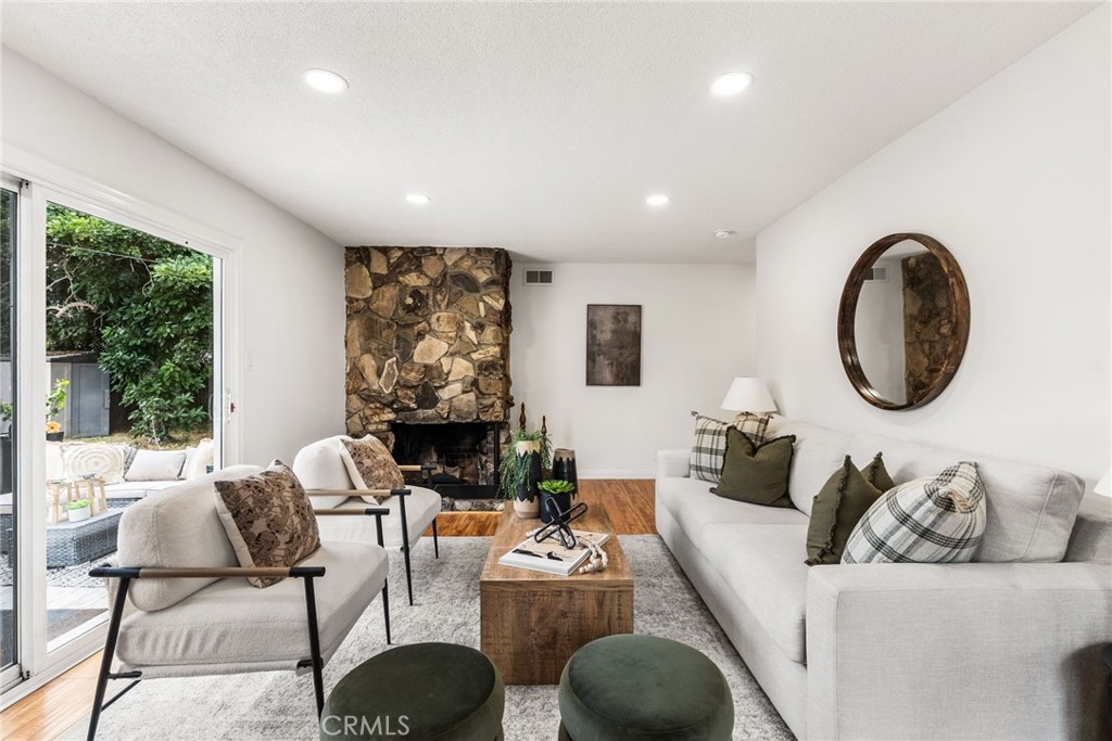 13361 Roxey Drive Garden Grove, CA 92843 - Photo 3 of 31 a living room with furniture a large window and a large mirror