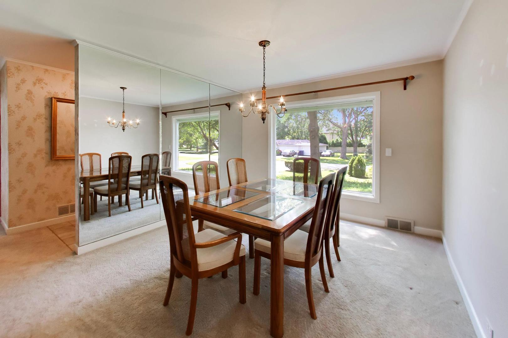 103 Cottonwood Road Northbrook, IL 60062 - Photo 7 of 50 a dining room with furniture window outside view and wooden floor