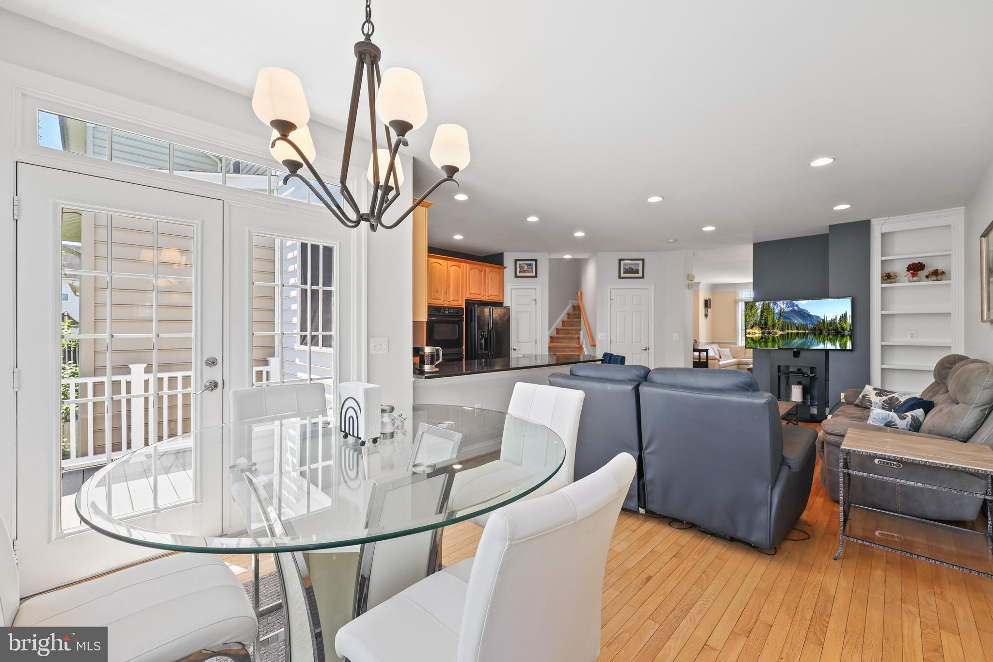6806 Witton Circle Gainesville, VA 20155 - Photo 41 of 47 a view of a dining room with furniture window and wooden floor