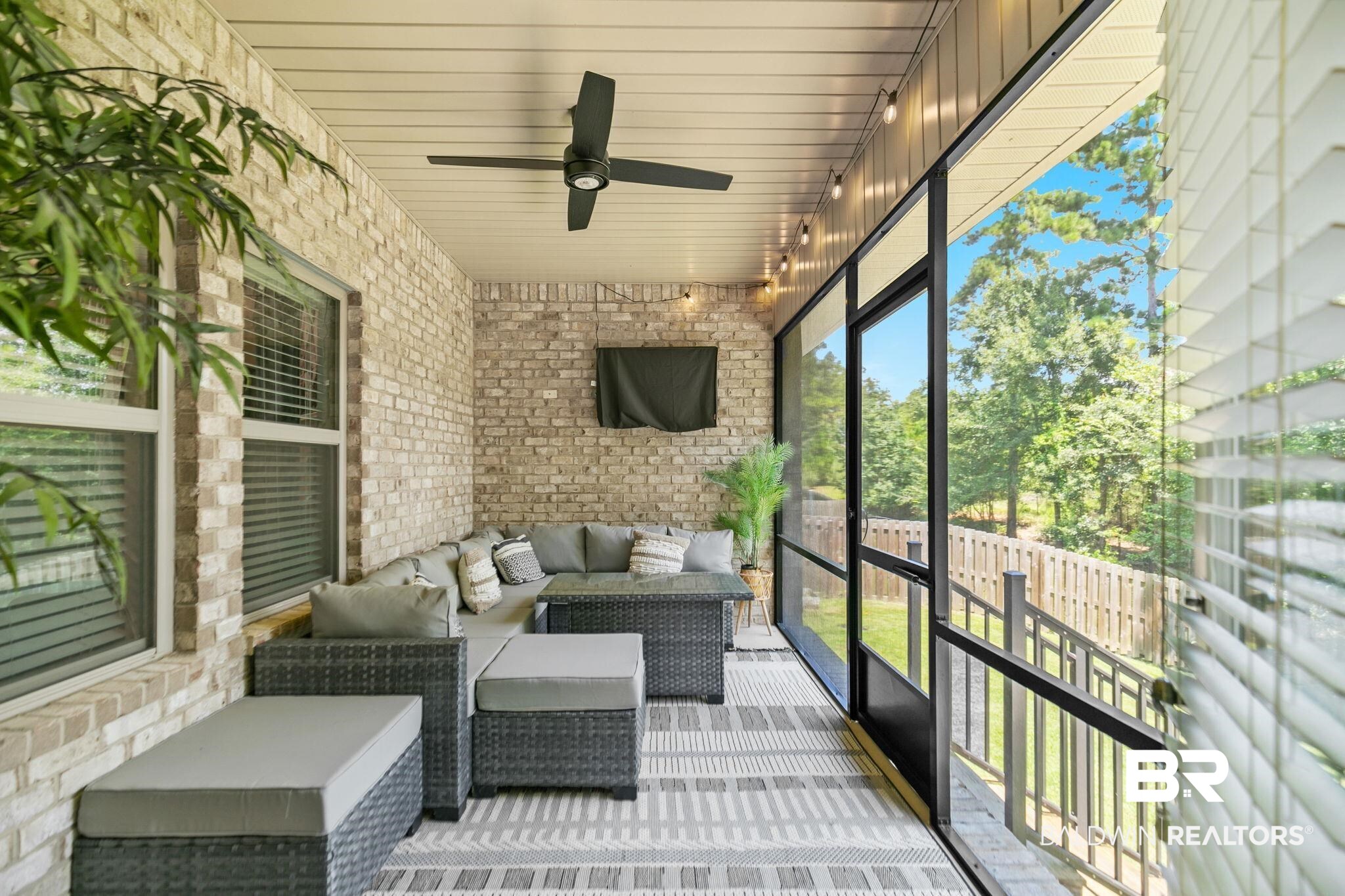 31402 Hoot Owl Road Daphne, AL 36527 - Photo 29 of 43 Unfurnished sunroom featuring rail lighting and ceiling fan
