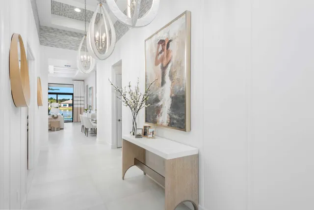 a view of living room with furniture and a chandelier