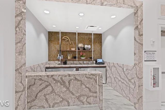 a kitchen with counter top space and stainless steel appliances