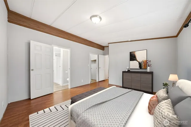 a bedroom with a bed and a dresser