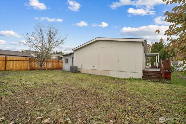 a view of a house with wooden floor and stairs