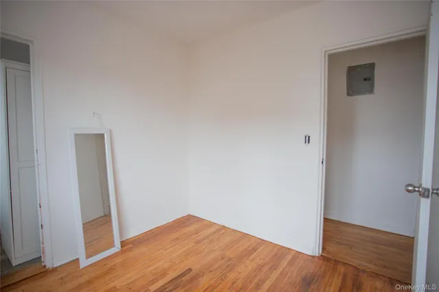 an empty room with wooden floor