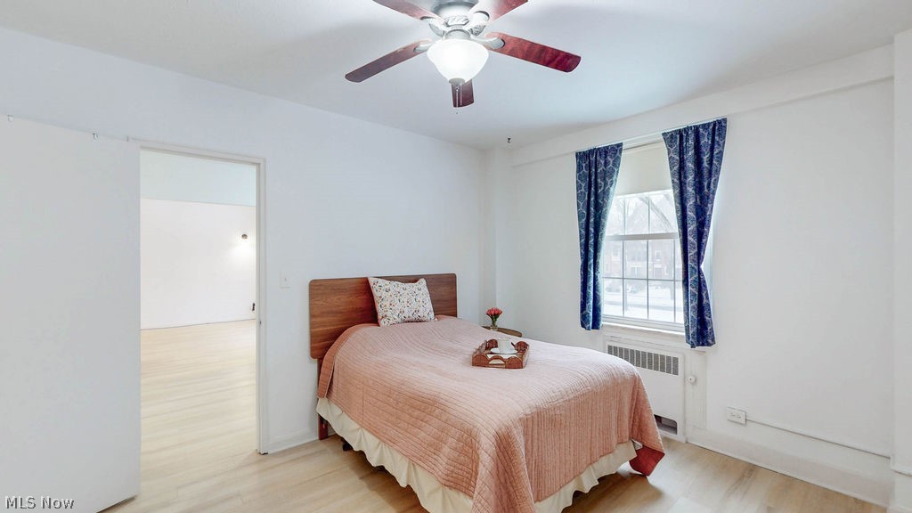 13800 Fairhill Road, Unit 203 Cleveland, OH 44120 - Photo 14 of 28 Primary bedroom featuring white oak style LVP flooring.