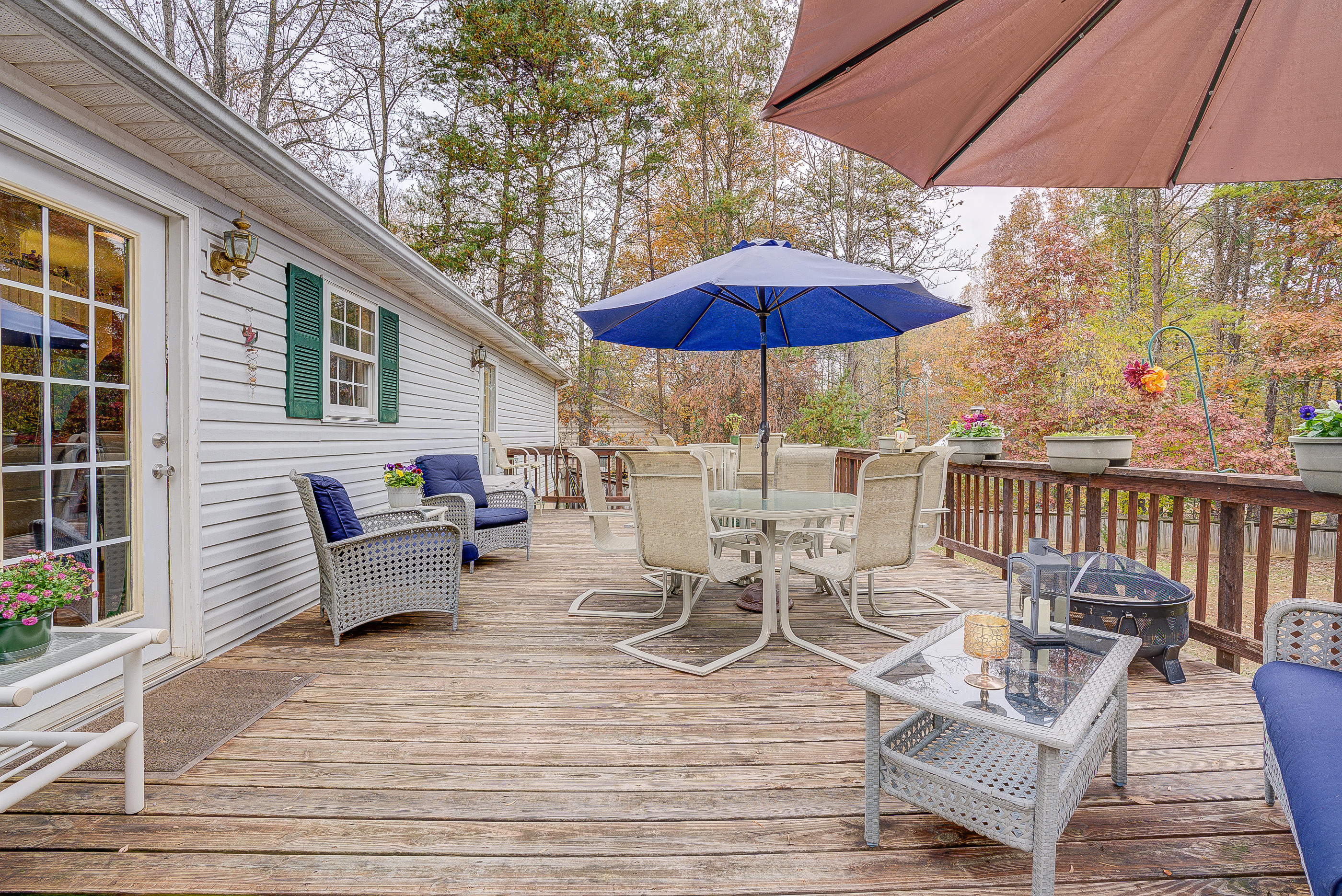 3339 Quarles Road Thaxton, VA 24174 - Photo 22 of 28 a view of a patio with wooden floor a yard a table and chairs