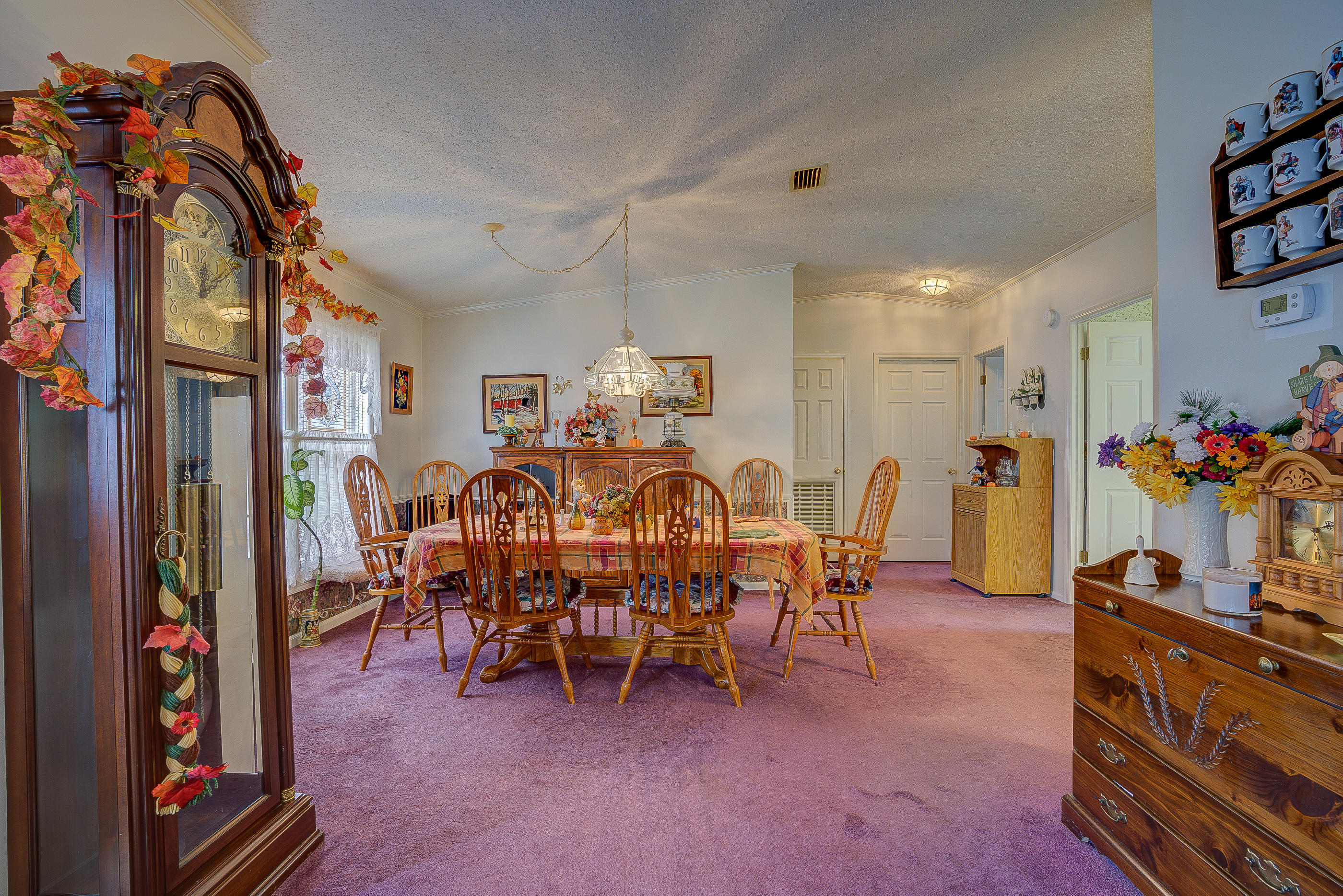 3339 Quarles Road Thaxton, VA 24174 - Photo 8 of 28 a view of a dining room with furniture and chandelier