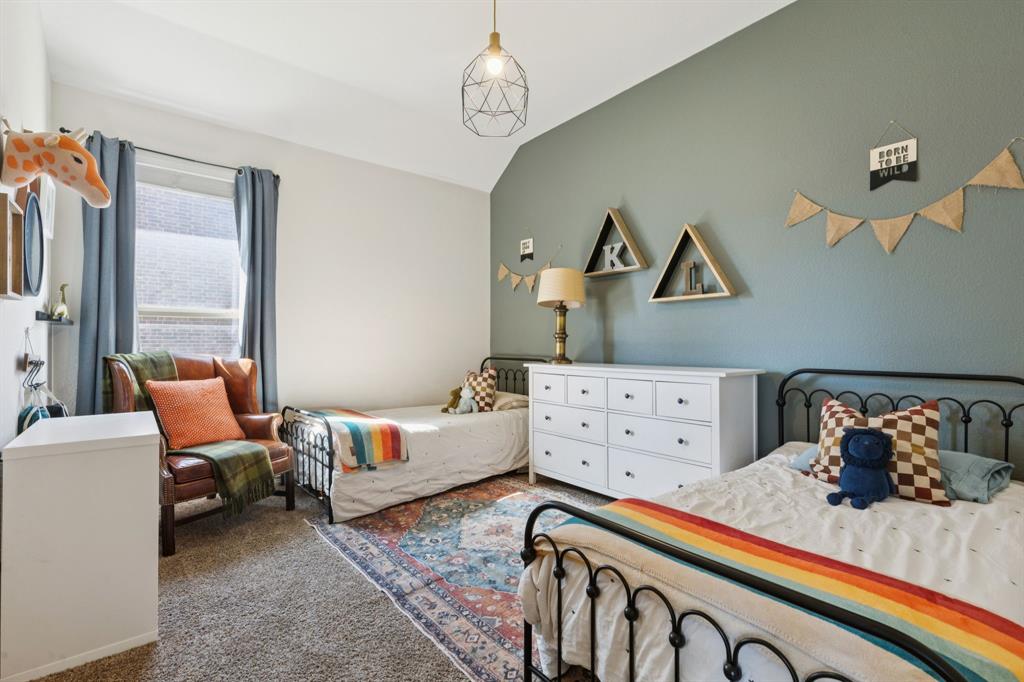 1326 White Water Lane Rockwall, TX 75087 - Photo 19 of 34 a bedroom with furniture and a window