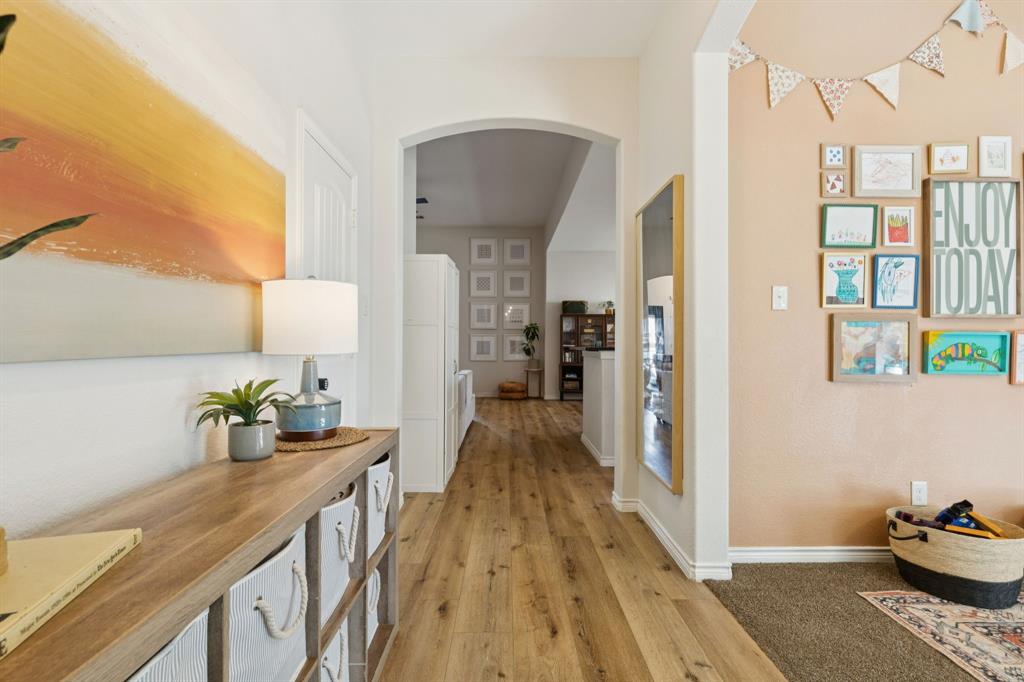 1326 White Water Lane Rockwall, TX 75087 - Photo 2 of 34 a kitchen with stainless steel appliances kitchen island granite countertop a refrigerator and a sink