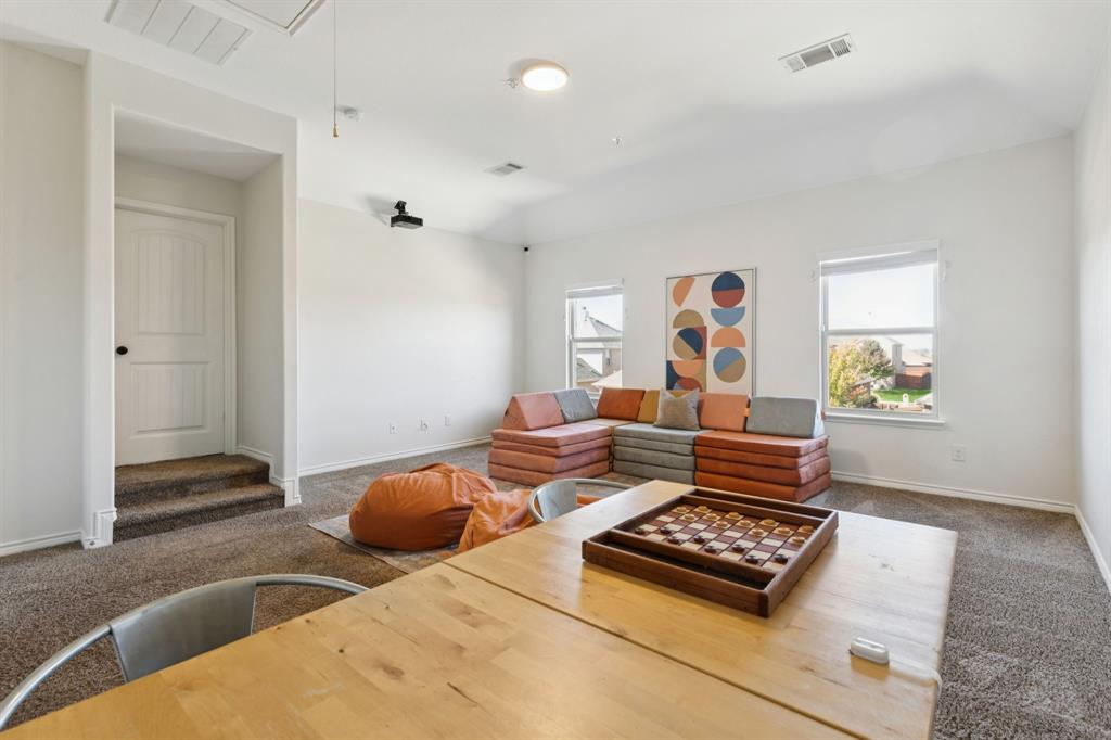 1326 White Water Lane Rockwall, TX 75087 - Photo 21 of 34 a living room with furniture and a window