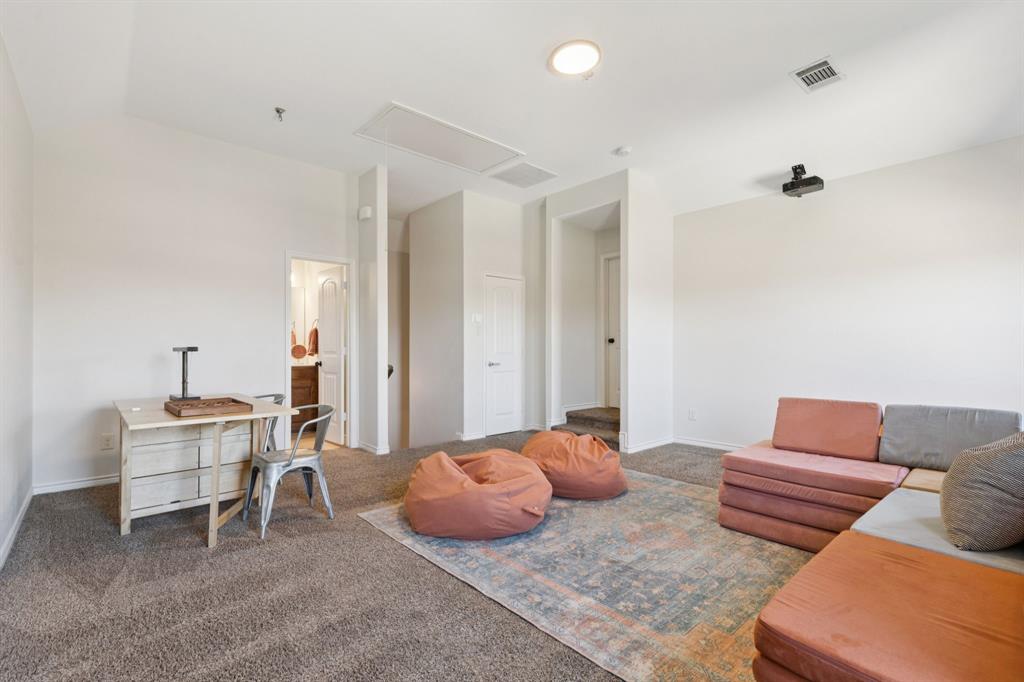 1326 White Water Lane Rockwall, TX 75087 - Photo 22 of 34 a bedroom with furniture and a couch
