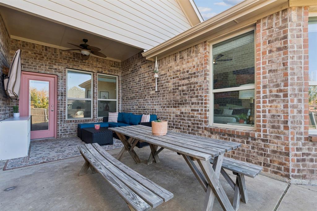 1326 White Water Lane Rockwall, TX 75087 - Photo 27 of 34 a balcony with furniture and a potted plant