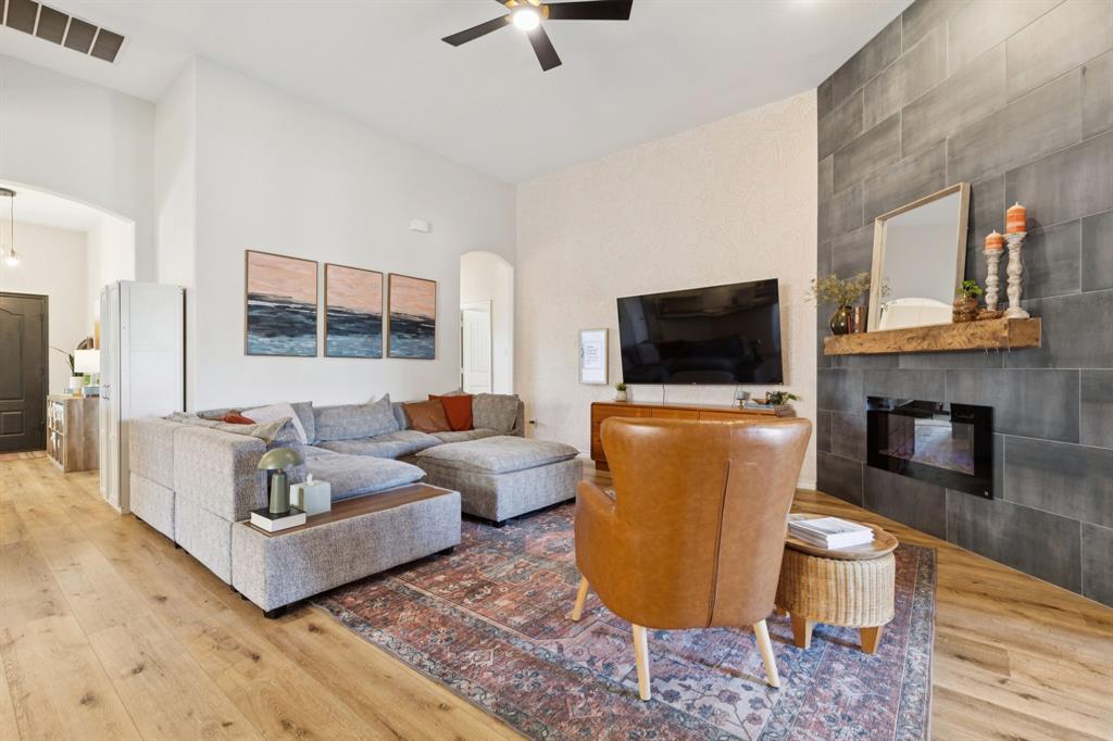 1326 White Water Lane Rockwall, TX 75087 - Photo 4 of 34 a living room with furniture and a flat screen tv