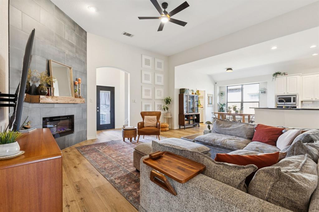 1326 White Water Lane Rockwall, TX 75087 - Photo 5 of 34 a living room with furniture and a fireplace