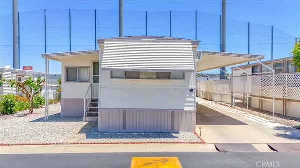a view of a kitchen with wooden cabinets