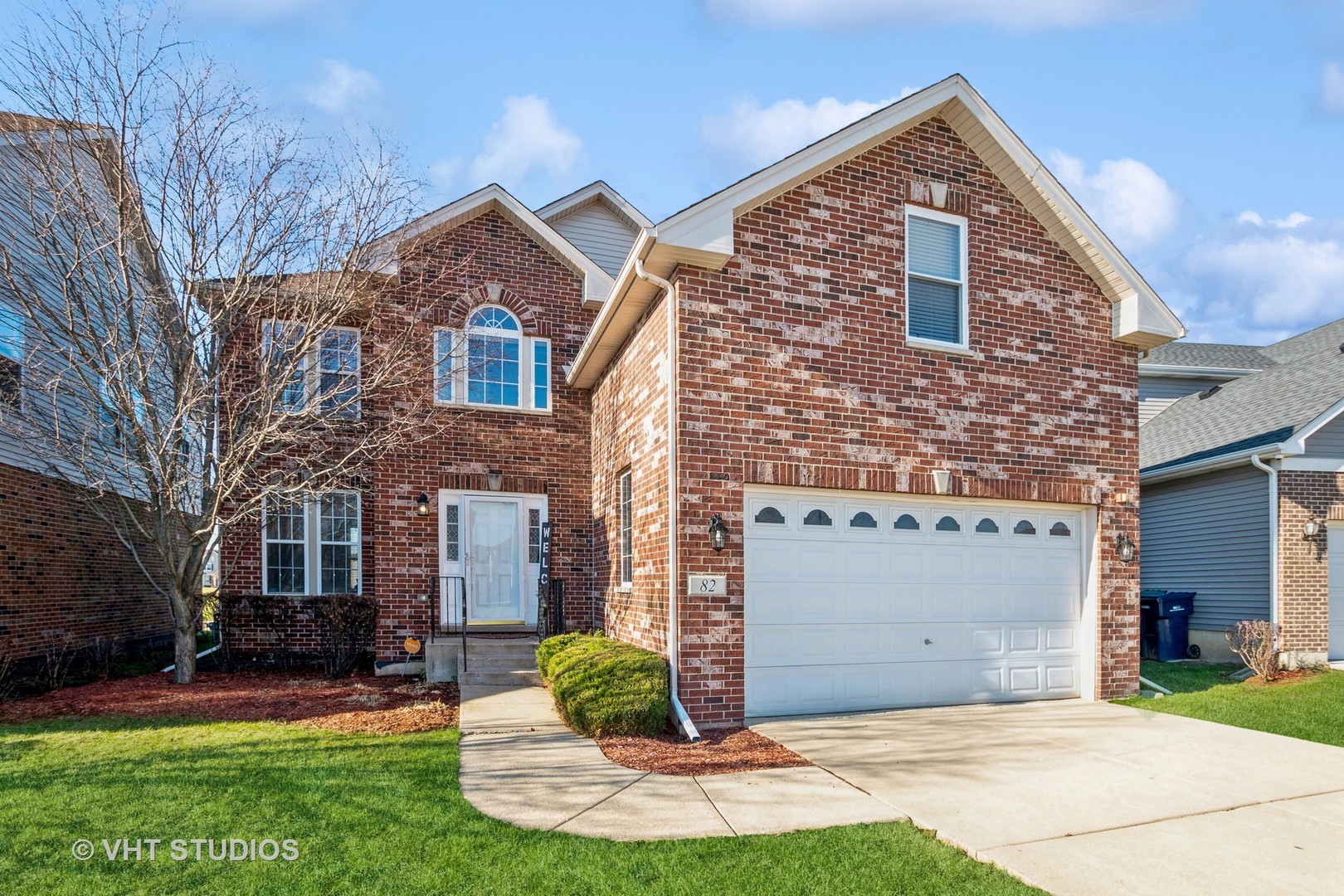 82 Stephens Matteson, IL 60443 - Photo 1 of 33 a front view of a house with a yard and garage