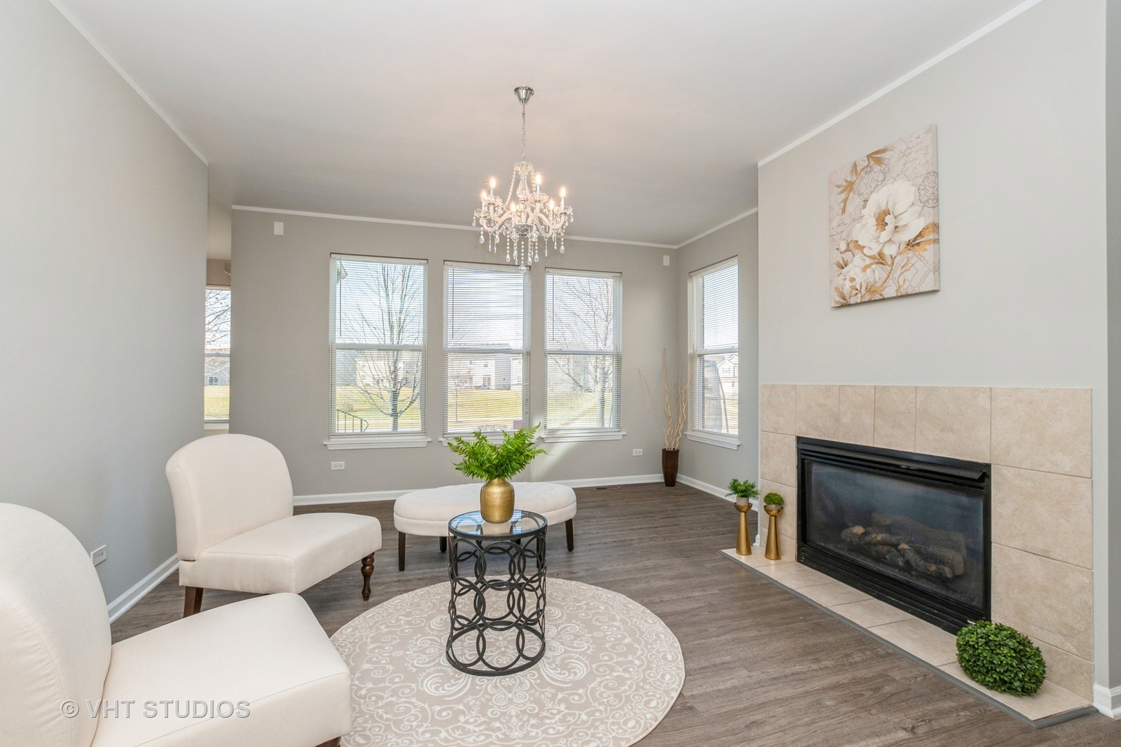 82 Stephens Matteson, IL 60443 - Photo 12 of 33 a living room with furniture a fireplace and windows