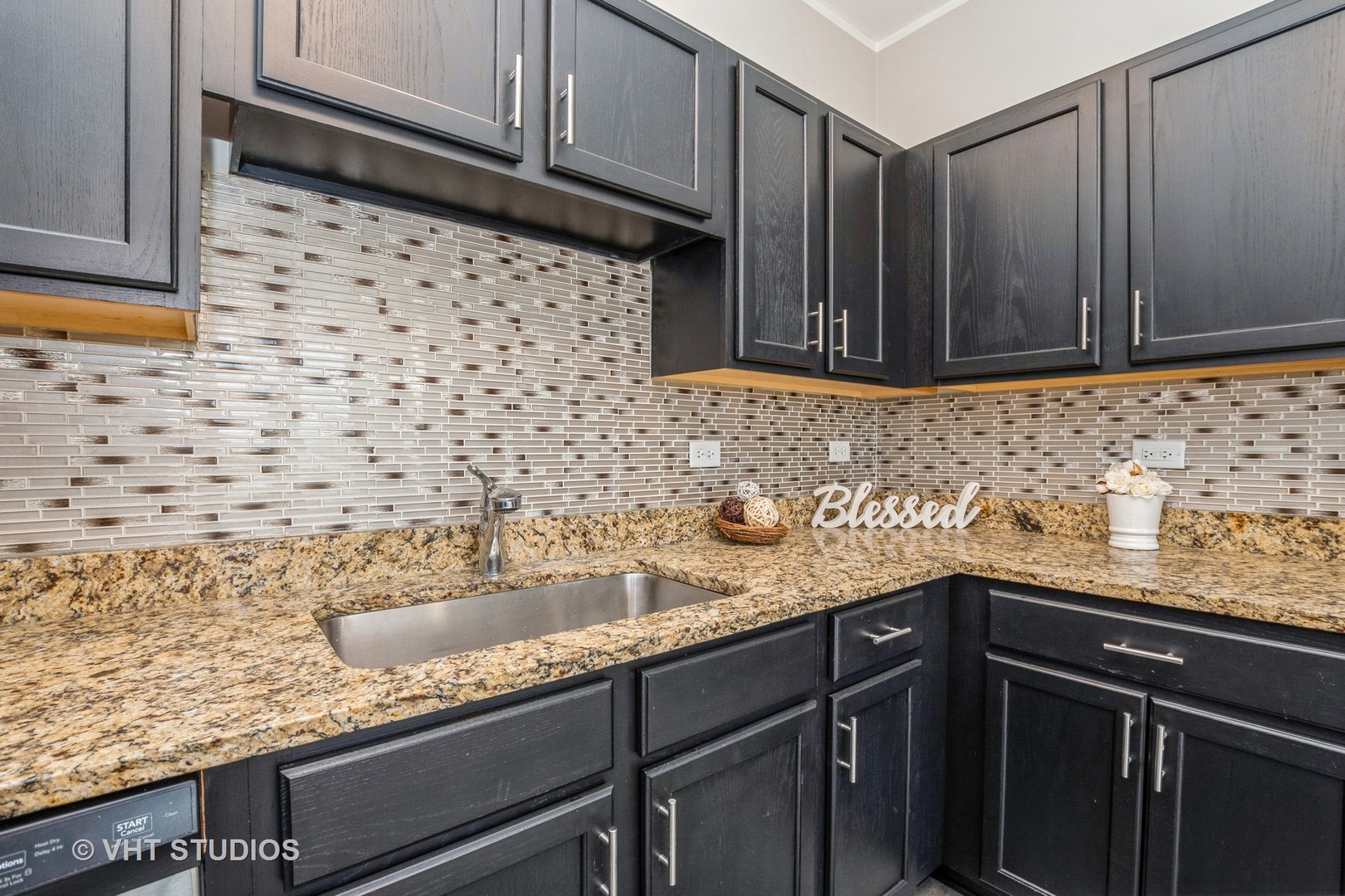 82 Stephens Matteson, IL 60443 - Photo 9 of 33 a kitchen with granite countertop a sink and wooden cabinets