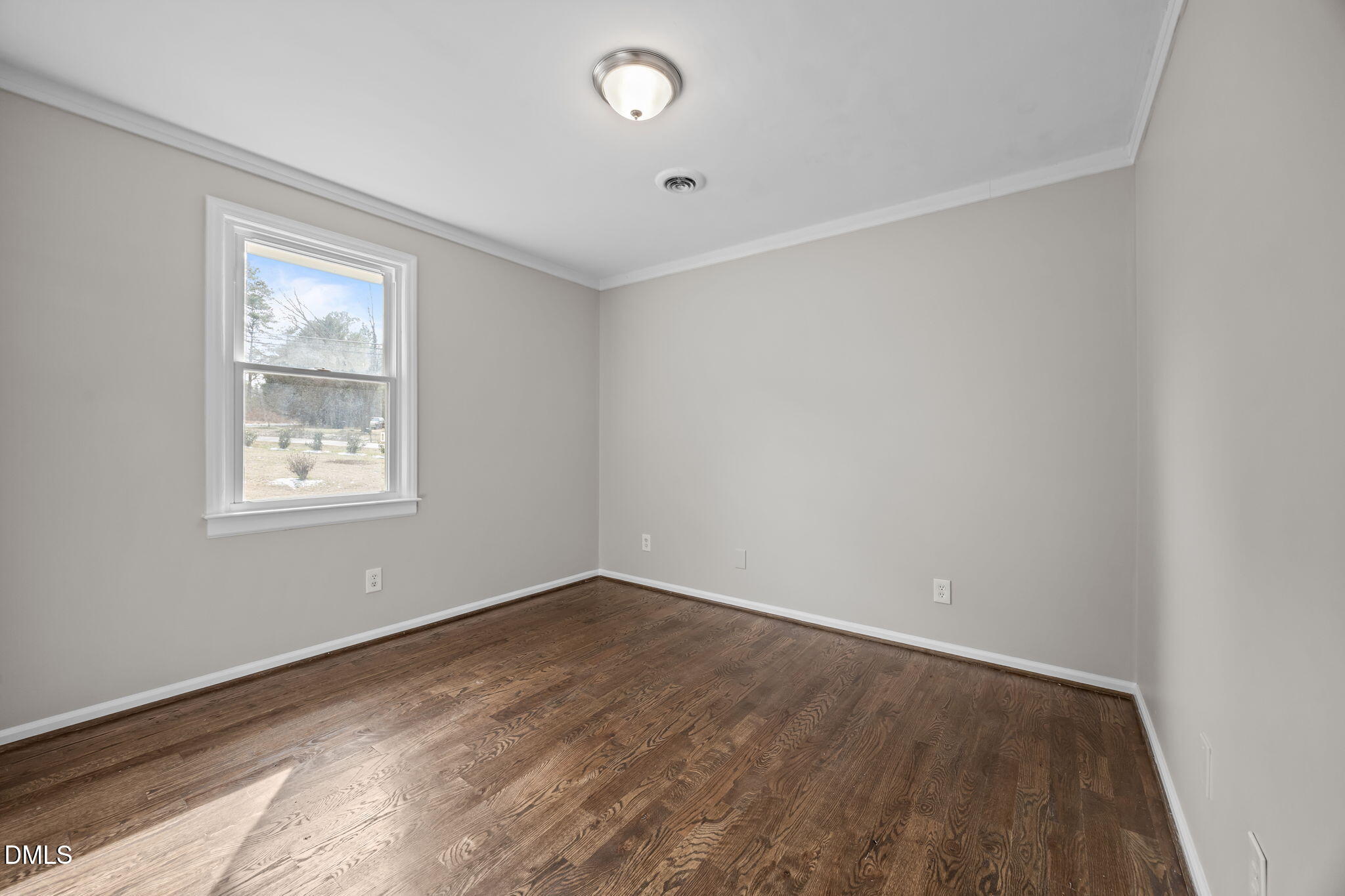 700 Woodland Road Raleigh, NC 27603 - Photo 11 of 35 an empty room with a window