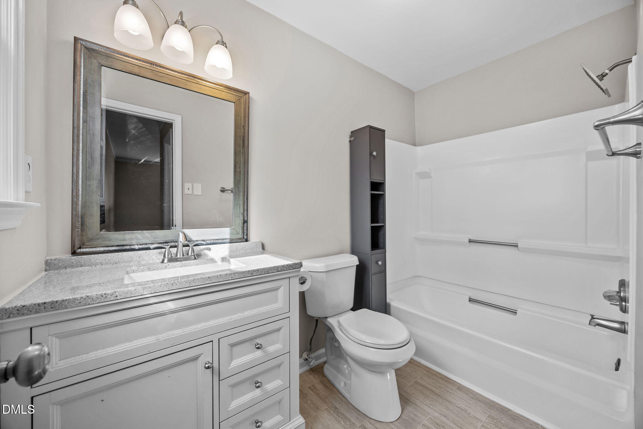 700 Woodland Road Raleigh, NC 27603 - Photo 16 of 35 a bathroom with a toilet a sink and a bathtub